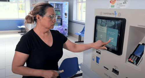 Customer using VAC in laundromat