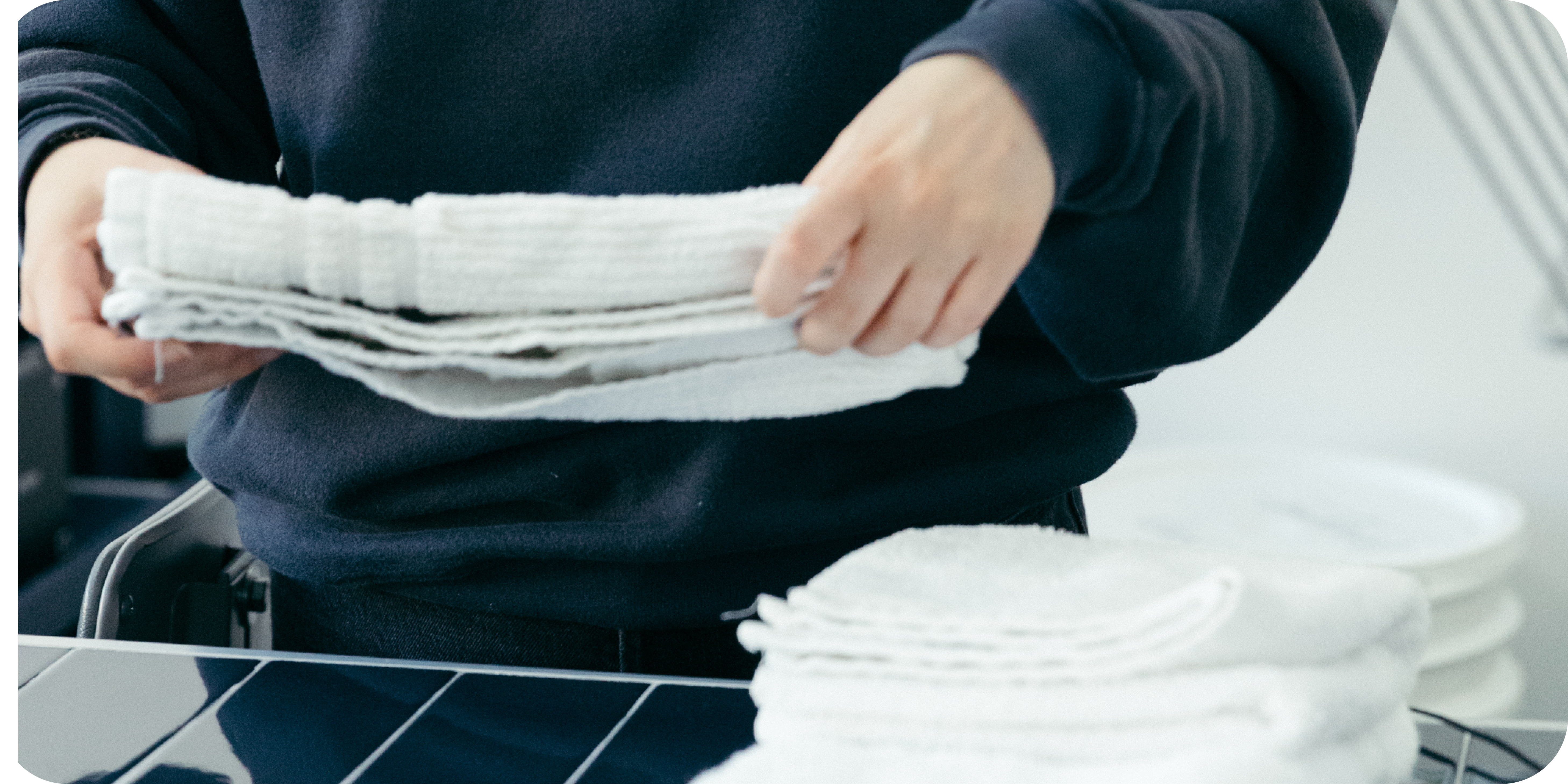 folding towels in laundromat